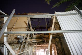 Damage is shown following an Iranian ballistic missile attack on March 18, 2026 in the Tel Aviv suburb of Ramat Gan, Israel